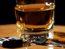car keys sitting next to a glass of whiskey