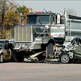 three car accident involving a semi and two sedans