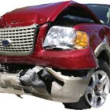 crushed red ford SUV